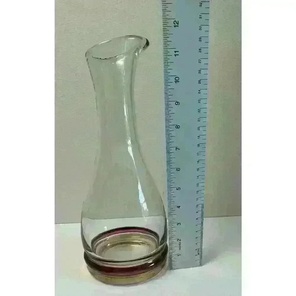 Vintage Glass decanter with cranberry and yellow colored bands on base Beautiful